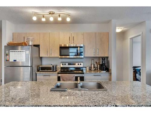 3324-4641 128 Avenue Ne, Calgary, AB - Indoor Photo Showing Kitchen With Stainless Steel Kitchen With Double Sink With Upgraded Kitchen