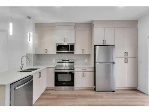 109-75 Cornerstone Row Ne, Calgary, AB - Indoor Photo Showing Kitchen With Stainless Steel Kitchen With Double Sink With Upgraded Kitchen