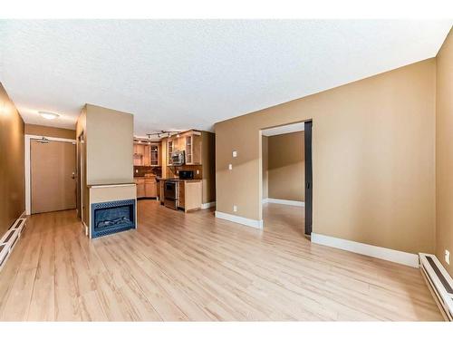 102-1530 16 Avenue Sw, Calgary, AB - Indoor With Fireplace