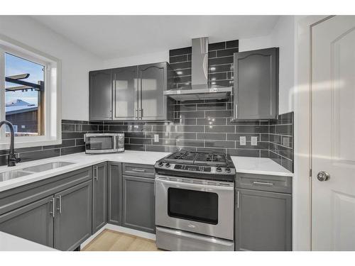 2469 Ravenswood View Se, Airdrie, AB - Indoor Photo Showing Kitchen With Double Sink With Upgraded Kitchen