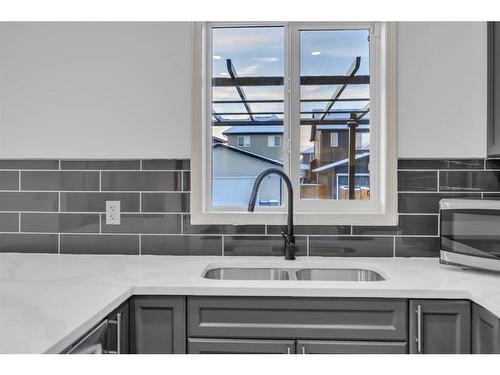 2469 Ravenswood View Se, Airdrie, AB - Indoor Photo Showing Kitchen With Double Sink