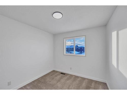 2469 Ravenswood View Se, Airdrie, AB - Indoor Photo Showing Other Room