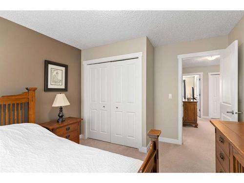 235 Rockyspring Grove Nw, Calgary, AB - Indoor Photo Showing Bedroom