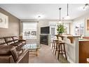 235 Rockyspring Grove Nw, Calgary, AB  - Indoor Photo Showing Living Room With Fireplace 