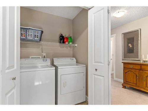 235 Rockyspring Grove Nw, Calgary, AB - Indoor Photo Showing Laundry Room