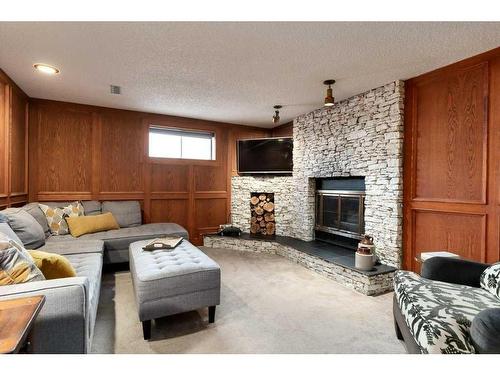 16 Cedardale Rise Sw, Calgary, AB - Indoor Photo Showing Living Room With Fireplace