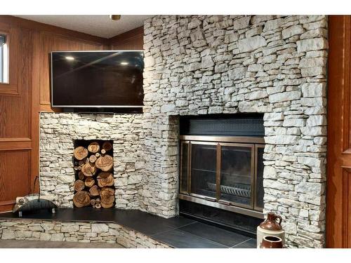 16 Cedardale Rise Sw, Calgary, AB - Indoor Photo Showing Other Room With Fireplace