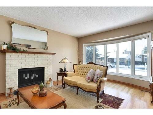 16 Cedardale Rise Sw, Calgary, AB - Indoor Photo Showing Living Room With Fireplace