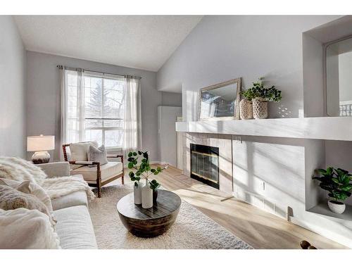 80 Chaparral Ridge Circle Se, Calgary, AB - Indoor Photo Showing Living Room With Fireplace