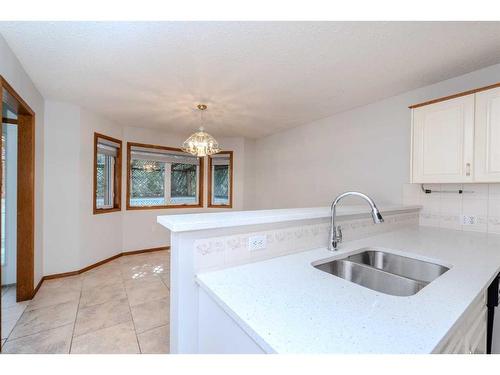 64 Chaparral Way Se, Calgary, AB - Indoor Photo Showing Kitchen With Double Sink