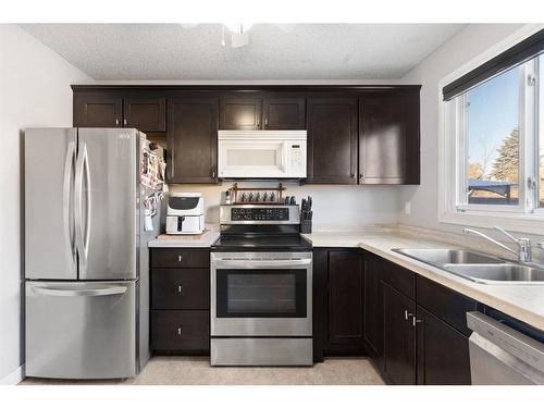 92 Abergale Way Ne, Calgary, AB - Indoor Photo Showing Kitchen With Double Sink