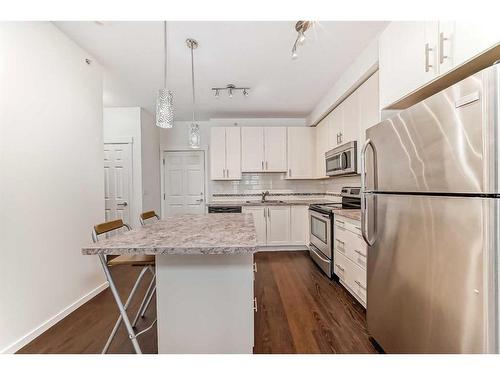 1408-755 Copperpond Boulevard Se, Calgary, AB - Indoor Photo Showing Kitchen With Stainless Steel Kitchen With Upgraded Kitchen