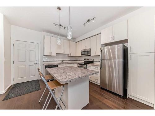 1408-755 Copperpond Boulevard Se, Calgary, AB - Indoor Photo Showing Kitchen With Stainless Steel Kitchen With Upgraded Kitchen