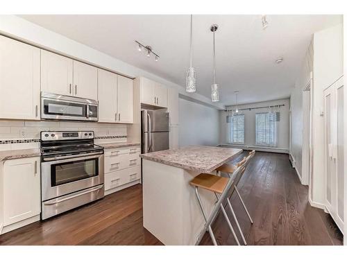 1408-755 Copperpond Boulevard Se, Calgary, AB - Indoor Photo Showing Kitchen With Stainless Steel Kitchen With Upgraded Kitchen