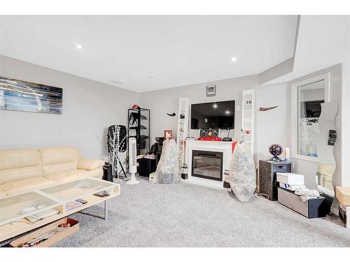 94 Everridge Court Sw, Calgary, AB - Indoor Photo Showing Living Room With Fireplace