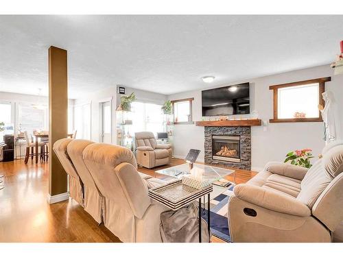 94 Everridge Court Sw, Calgary, AB - Indoor Photo Showing Living Room With Fireplace