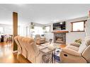 94 Everridge Court Sw, Calgary, AB  - Indoor Photo Showing Living Room With Fireplace 