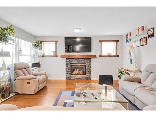 94 Everridge Court Sw, Calgary, AB - Indoor Photo Showing Living Room With Fireplace