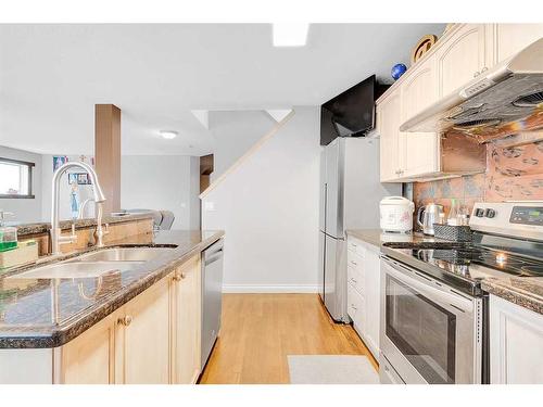 94 Everridge Court Sw, Calgary, AB - Indoor Photo Showing Kitchen With Double Sink