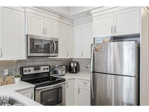 122-20 Seton Park Se, Calgary, AB - Indoor Photo Showing Kitchen With Stainless Steel Kitchen With Double Sink