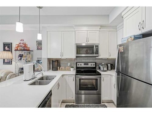 122-20 Seton Park Se, Calgary, AB - Indoor Photo Showing Kitchen With Stainless Steel Kitchen With Double Sink