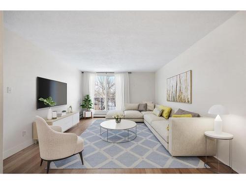 18B-80 Galbraith Drive Sw, Calgary, AB - Indoor Photo Showing Living Room