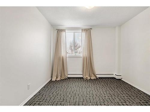 18B-80 Galbraith Drive Sw, Calgary, AB - Indoor Photo Showing Other Room