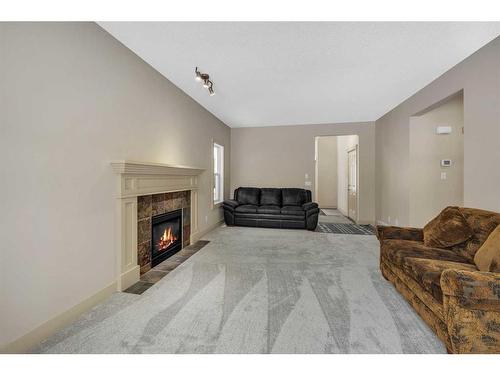 72 Sherwood Way Nw, Calgary, AB - Indoor Photo Showing Living Room With Fireplace