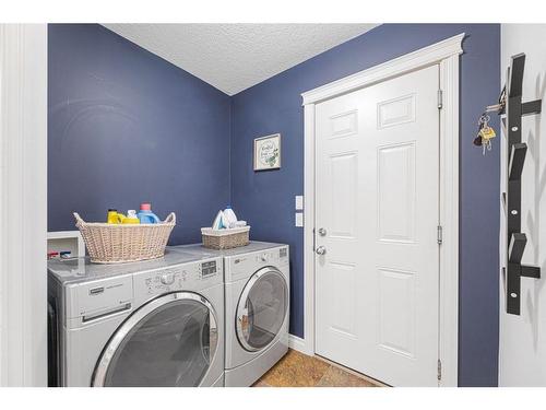 7 Jumping Pound Terrace, Cochrane, AB - Indoor Photo Showing Laundry Room