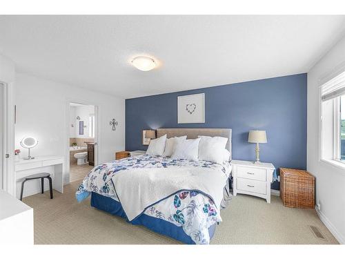 7 Jumping Pound Terrace, Cochrane, AB - Indoor Photo Showing Bedroom