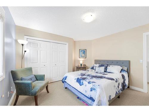 7 Jumping Pound Terrace, Cochrane, AB - Indoor Photo Showing Bedroom