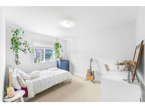 7 Jumping Pound Terrace, Cochrane, AB - Indoor Photo Showing Bedroom