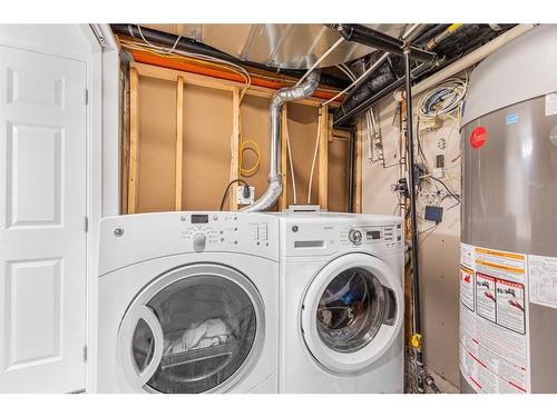 7 Jumping Pound Terrace, Cochrane, AB - Indoor Photo Showing Laundry Room