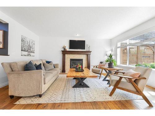 7 Jumping Pound Terrace, Cochrane, AB - Indoor Photo Showing Living Room With Fireplace