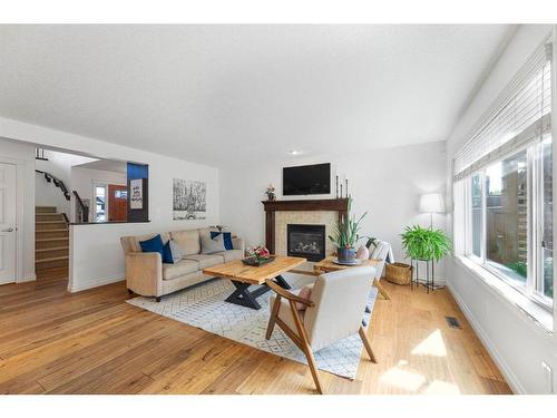 7 Jumping Pound Terrace, Cochrane, AB - Indoor Photo Showing Living Room With Fireplace