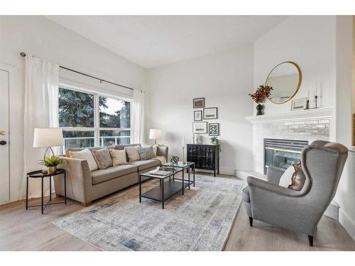 364 Prominence Heights Sw, Calgary, AB - Indoor Photo Showing Living Room With Fireplace