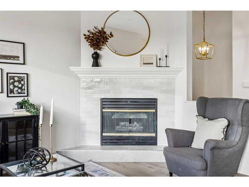 364 Prominence Heights Sw, Calgary, AB - Indoor Photo Showing Living Room With Fireplace