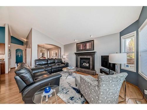 60 Brightondale Close Se, Calgary, AB - Indoor Photo Showing Living Room With Fireplace