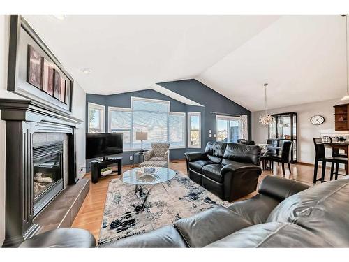 60 Brightondale Close Se, Calgary, AB - Indoor Photo Showing Living Room With Fireplace