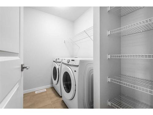 127 Aquila Drive Nw, Calgary, AB - Indoor Photo Showing Laundry Room