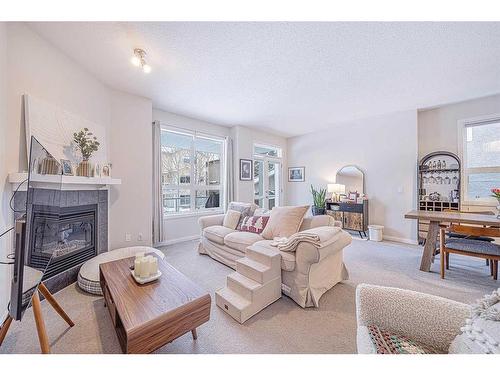 12 Royal Manor Nw, Calgary, AB - Indoor Photo Showing Living Room With Fireplace