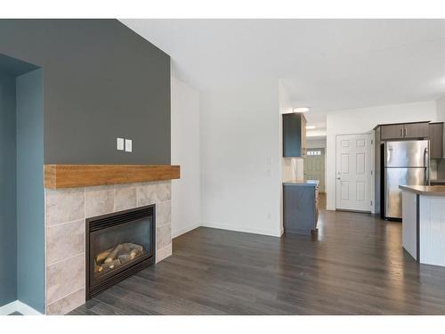 118 Copperpond Landing Se, Calgary, AB - Indoor Photo Showing Living Room With Fireplace