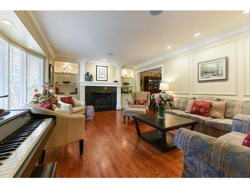 6948 Livingstone Drive Sw, Calgary, AB - Indoor Photo Showing Living Room With Fireplace