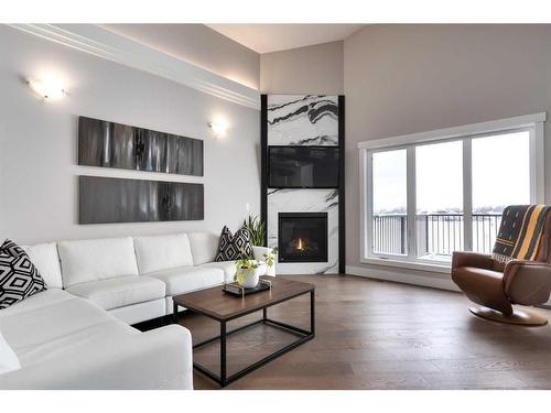 702 Fairways Drive, Vulcan, AB - Indoor Photo Showing Living Room With Fireplace