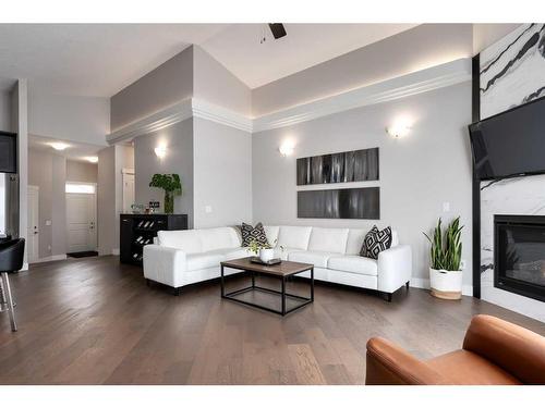 702 Fairways Drive, Vulcan, AB - Indoor Photo Showing Living Room With Fireplace