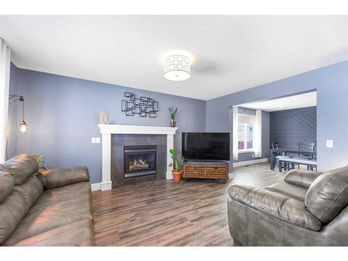 215 West Creek Close, Chestermere, AB - Indoor Photo Showing Living Room With Fireplace