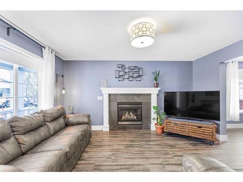 215 West Creek Close, Chestermere, AB - Indoor Photo Showing Living Room With Fireplace