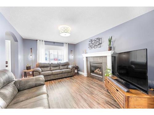 215 West Creek Close, Chestermere, AB - Indoor Photo Showing Living Room With Fireplace