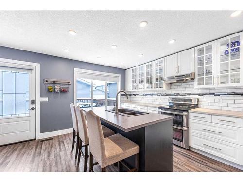 215 West Creek Close, Chestermere, AB - Indoor Photo Showing Kitchen With Double Sink