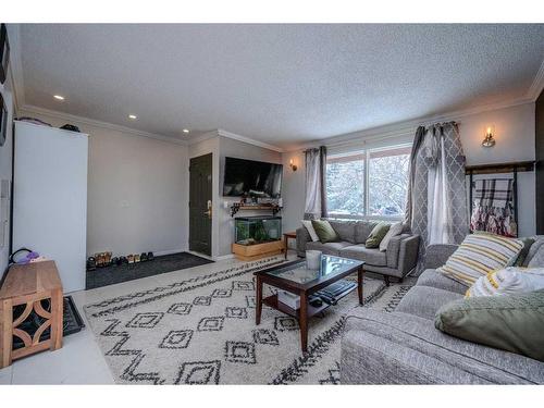 456 Cannington Close Sw, Calgary, AB - Indoor Photo Showing Living Room With Fireplace